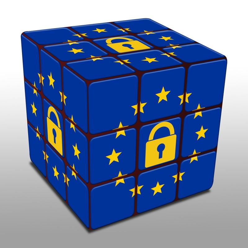Rubic's cube with European blue and stars, and a padlock inside